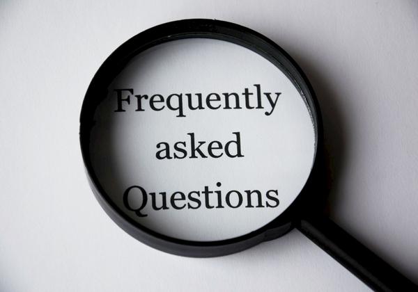Frequently asked Questions in a magnifying glass