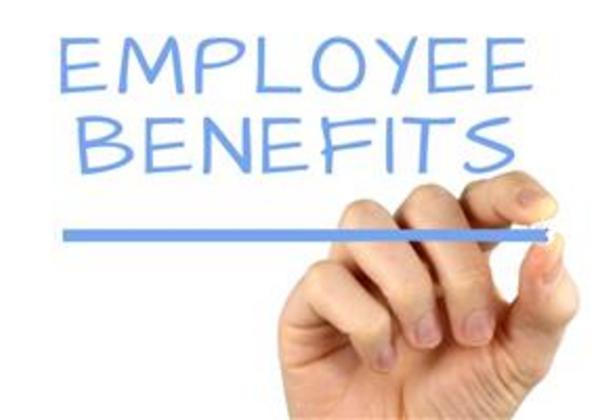 unattached hand writes the words employee benefits