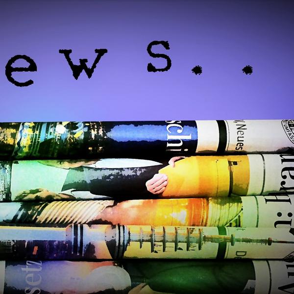 Colourful stack of folded newspapers with the text "News...." above it.
